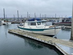 27 longhouse, outboard (Homer, AK harbor, May 2023). Boat now for sale Sept 2023.