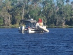 Dinghy clearing water.