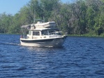 dingy secured, with lines from hand rails on cabin top across the dinghy and tightened both fore and aft.