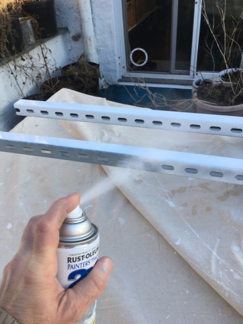 this cheap project came together when I dumpster dove some long lenghts of 12-Gauge Electro-Galvanized Half Slot Steel Strut Channel which I painted white. I don't consider this a permanent fixture on the boat otherwise I would have sourced some sort of aluminium or even SS chanel   