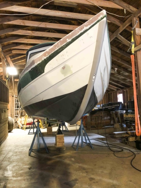 Bottom work is finished and the boat is now supported in six locations. Note the yellow ratchet strap and orange recovery strap hanging to the right.