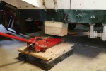 Here the floor jack is being used with the extension for lifting the stern.
