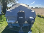 Boat cover, stern view.  Zipper door for entry without removing cover.