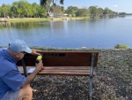 Tom installing memorial plague for Larry Krabach