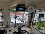 Moved from below the helm for better viz and keep from changing the channel with my knee. 
