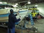 (catdogcat) Scrubbing the boat.