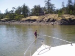 Anne demonstrating shallow water anchoring techniques