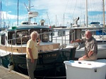 Met these folks at Cap Sante Marina on 7-18-07.  Unfortunately, I misplaced their names.  They were just putting the registration numbers on there new R25.