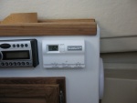 A/C controls mounted next to sound system