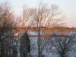 Coal barge behind the house on the river