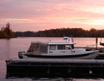 Fall Sunrise at Goosepond Marina features vivid pink hues.