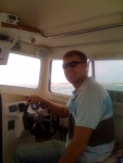 My son, John, at the helm