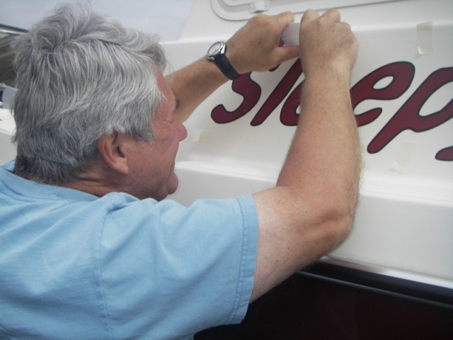 Lettering nearly fills the flat portion of the space.