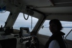 Dee piloting Knotty C on the way to Ketchikan, Alaska