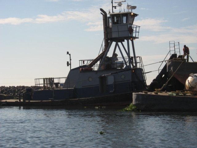 tow boat and barge dredging 