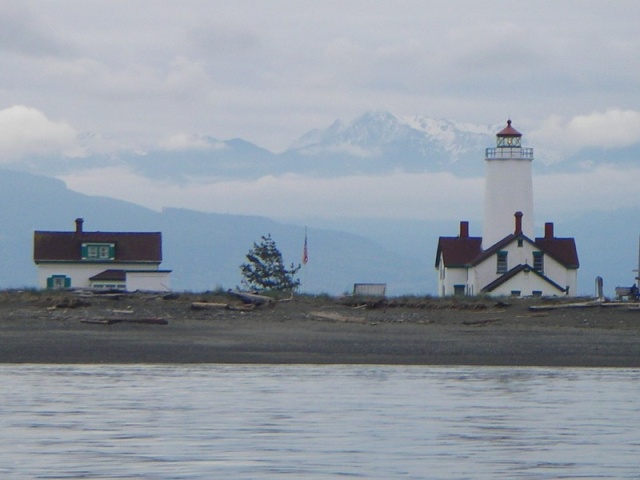 New Dungeness Lighthouse on Dungeness Spit, 7  mile long worlds longest natural sand spit, with the Olympic Mountians in the background.