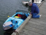 Harvey checking small boat.  This has got to be the smallest with the most power.  This one had two on board when they came into the dock.