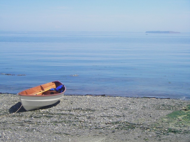 Home built, stich & glue, nice boat, grumpy owner.  At Port Williams, just out of Sequim Bay, with Protection Island just across the glass.