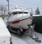 April snow covers the boat.