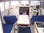 Table can also be positioned between the helm and passenger seat.