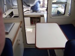 I did not include a picture, but the table and pedestal can be removed and laid on the v-berth for complete out of the way day time storage.