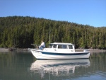 (AnchortownJim)My buddy Bill on the bow in Pigot Bay, PWS, 6/19/04