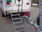 Highlight for Album: Towing rig, camper, deck Stairs fold up and stay right where they are.