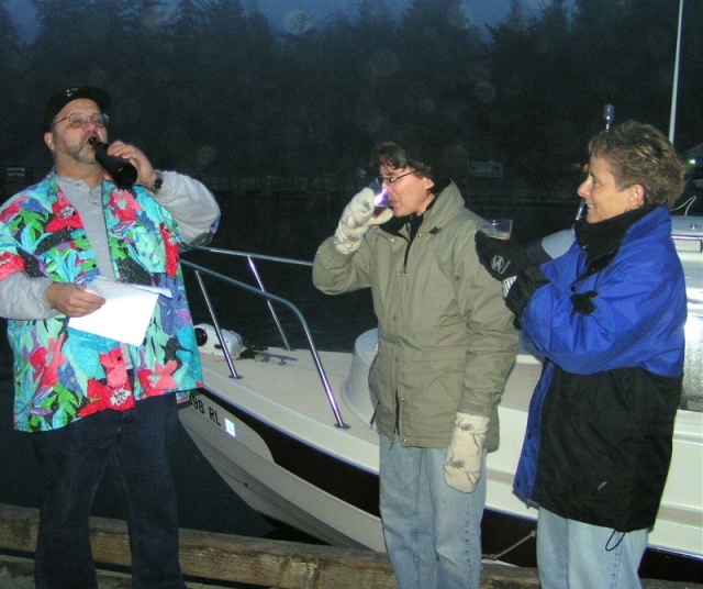(Pat Anderson) Rev Jim christening boat-y-sattva - take a sip!