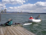 Jay arriving at Eagle Bay dock towing in couple in RIB who's motor had quit several miles out