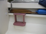 My solution to the big step in getting in and out of the cockpit.  Added a second step attached to tray below gunwale and supported by two vertical members.  Wood is purpleheart which is one third price of  teak and weathers to look like teak.