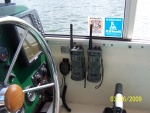 I have 2 hand held radio's and have mounted the charging brackets in the helm next to the on board vhf radio mic.  They are wired in to stay charged