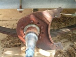Old rusted backing plate that held caliper (Kodiak).