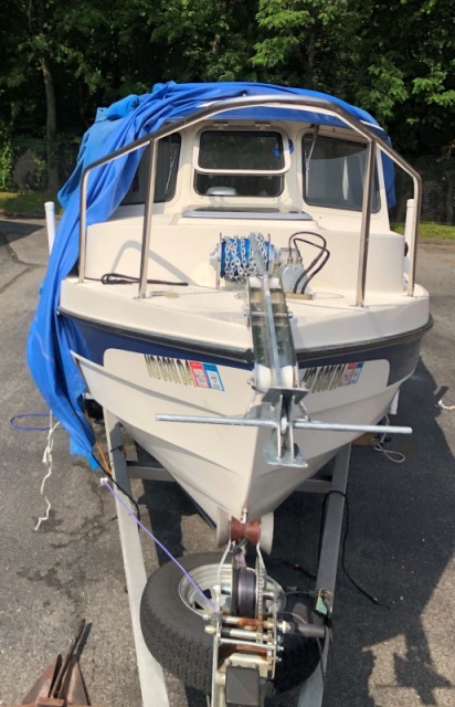 Lone Star Marine Anchor Winch with 13 lbs anchor and 20' of chain holds the boat nicely.