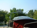 Tall stainless steel radar arch with radome, VHF antenna, and GPS antenna