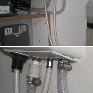 Aft wall of the under sink cabinet showing the hot water faucet "fix" by just tossing the nylon fitting and clamping directly to the faucet threads after heating the hose.