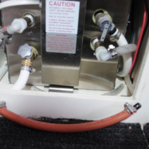 Seaward S700 Water Heater - 4 Pipes, open the two valves (drain and pressure vent) and connect the other two hoses (cold supply left, hot output right) on barbs together with 13" hose and two 1/2" double barbs.