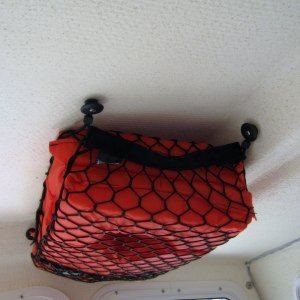 I used an expandable storage bag that I bought at SEARS.I rplaces the screws with 10-32 machine scrwes with cap nuts on top.Makes agreat life jacket holder.