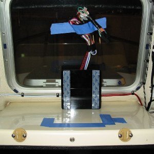 1/2" Seaboard(Tap Plastics)abuts window frame and allows speaker bracket to be scooted over to clear wall. No holes and speakers rotate over 90 degrees.