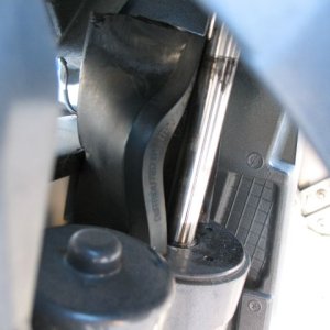 You can see a "slot" cast into the boat side of the motor mount toward the upper right. There is one of these each side and my new "wedge" fits into them.
