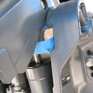 Taped some dense rubber stripping onto the top (the tape is just to hold it in place while the motor comes down, so I don't have to have my fingers in there).