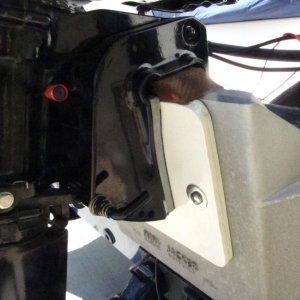 Media '' in album 'M-Y Wedge slipped out of place and deformed, not sure why (did work fine for a different 3,000-mile tow).  This allowed the motor to come down somewhat, but luckily not all the way as it "wedged" between the tilt cylinder and the transom.'