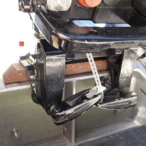 Media '' in album 'M-Y Wedge slipped out of place and deformed, not sure why (did work fine for a different 3,000-mile tow).  This allowed the motor to come down somewhat, but luckily not all the way as it "wedged" between the tilt cylinder and the transom.'