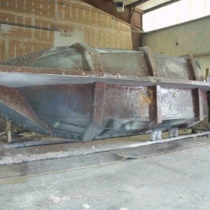 Lower half in the mold (this could be any boat, hope it's ours)! 2/23/04