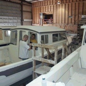 Installing rear window (Starboard side view).  No rails or door yet. 3/8/04