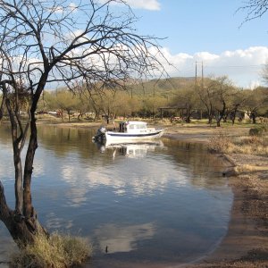 on the beach at Palo verde boat area canyon Lake.  Covered picnic tables, sand beach and toilets 100 yards from an excellent ramp