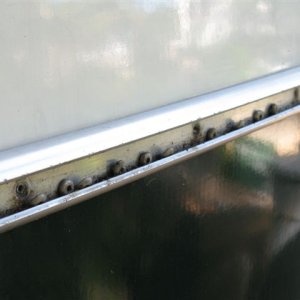 007 7
More rivet washers in the aluminum rail