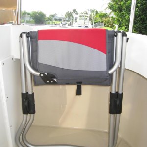 GCI Outdoor, Highlander Chair Folded. Black velcro strap holds chair closed.