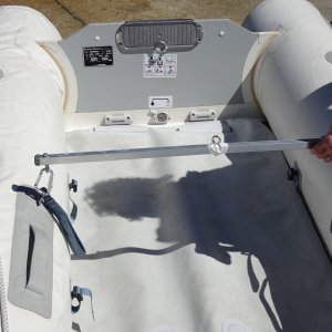 Aluminum square tubing with 5/8" dowel epoxied into middle. This has two sets of Carabiners.  The outer for lifting the dinghy with the Davit, and the inner for hoisting the window air conditioner inside of the cabin into its position.