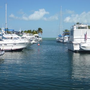 Kismet on the left with dinghy davits on the swim platform looking out at Florida Bay