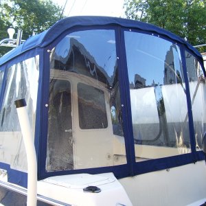 Added a great rain tight room. We have tint on our windows so privicy was not an issue as we can close our back door for privicy in the cabin area. Nice for fall travels. Have a small heater to warm this area up for morning coffee etc.